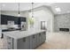 Gourmet kitchen with a large island, quartz countertops and stainless steel appliances at 6920 W Via Montoya Dr, Glendale, AZ 85310