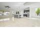 Open concept living area adjacent to the kitchen and features tile flooring and plenty of natural light at 6920 W Via Montoya Dr, Glendale, AZ 85310