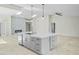Open-concept living room with quartz fireplace and modern fixtures at 6920 W Via Montoya Dr, Glendale, AZ 85310