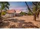 Beautiful sunset over a large backyard with mature trees at 7039 N 15Th St, Phoenix, AZ 85020