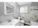 Tastefully designed bathroom with modern vanity, decorative tile, and updated fixtures at 7039 N 15Th St, Phoenix, AZ 85020