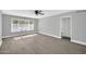 Bright bedroom with wood-look floors, large window, and ceiling fan at 7039 N 15Th St, Phoenix, AZ 85020