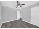 Gray bedroom with new floors, ceiling fan, and an ensuite bathroom at 7039 N 15Th St, Phoenix, AZ 85020