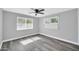 Gray bedroom with new floors, natural light and a ceiling fan at 7039 N 15Th St, Phoenix, AZ 85020