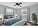 Comfortable bedroom featuring gray walls, windows, and a ceiling fan at 7039 N 15Th St, Phoenix, AZ 85020