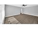 Spacious bedroom featuring wood-look flooring, a ceiling fan, and bright natural light at 7039 N 15Th St, Phoenix, AZ 85020