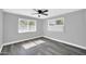 Relaxing bedroom with two windows and modern ceiling fan at 7039 N 15Th St, Phoenix, AZ 85020
