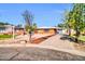 Charming home with desert landscaping, an attached garage, and an inviting front entrance at 7039 N 15Th St, Phoenix, AZ 85020