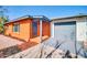 Home featuring a secure gated entryway and an attached garage with a gray door at 7039 N 15Th St, Phoenix, AZ 85020