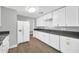 Bright kitchen featuring modern appliances, white cabinetry, and plenty of counter space at 7039 N 15Th St, Phoenix, AZ 85020