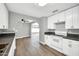 Charming kitchen with stainless steel sink, gray counters, and white cabinets at 7039 N 15Th St, Phoenix, AZ 85020
