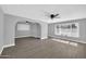 Open living room features contemporary gray walls, light floors, and large windows at 7039 N 15Th St, Phoenix, AZ 85020