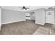 Open-concept living room featuring a dining area and modern wood-look flooring at 7039 N 15Th St, Phoenix, AZ 85020