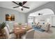 Bright, open living space with modern furniture, archways, and a dining area at 7039 N 15Th St, Phoenix, AZ 85020
