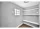 Small storage room featuring gray walls with open shelving at 7039 N 15Th St, Phoenix, AZ 85020