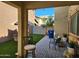 This backyard has pavers, green turf, seating, and an open view of surrounding homes at 7412 E Flower Ave, Mesa, AZ 85208