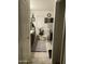 Well-lit bathroom featuring a vanity, decorative mirror, and neutral decor creating a clean and functional space at 7412 E Flower Ave, Mesa, AZ 85208