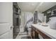 Bathroom features decorative shelving with mounted plants, a large decorative mirror, and modern fixtures at 7412 E Flower Ave, Mesa, AZ 85208