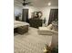 Comfortable bedroom with a chaise lounge, stylish decor, neutral colors, and soft natural light at 7412 E Flower Ave, Mesa, AZ 85208