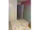 This bedroom has an open doorway, a vibrant colorful rug, and a unique dripping paint design on the wall at 7412 E Flower Ave, Mesa, AZ 85208