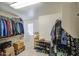 Walk-in closet with ample hanging space, shoe storage, and additional shelving for optimal organization at 7412 E Flower Ave, Mesa, AZ 85208