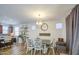 Open-concept dining room with natural light and seating for six guests at 7412 E Flower Ave, Mesa, AZ 85208
