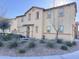 Charming two-story home featuring desert landscaping, neutral color palette, and architectural details at 7412 E Flower Ave, Mesa, AZ 85208