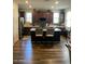 Spacious kitchen with an island, stainless steel appliances, and dark brown cabinetry for a modern look at 7412 E Flower Ave, Mesa, AZ 85208