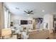 Bright, open living room features a ceiling fan, recessed lights, and lots of seating at 7412 E Flower Ave, Mesa, AZ 85208