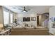 Bright living room with ceiling fan, recessed lights and lots of seating for guests at 7412 E Flower Ave, Mesa, AZ 85208