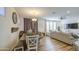 Bright living room featuring modern decor, hardwood floors, and lots of natural light at 7412 E Flower Ave, Mesa, AZ 85208