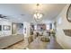 Open-concept layout showcases seamless transition from dining area into a comfortable living space at 7412 E Flower Ave, Mesa, AZ 85208