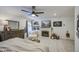 Bright main bedroom with a fireplace, neutral decor, and an abundance of natural light at 7412 E Flower Ave, Mesa, AZ 85208