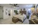 Inviting main bedroom with a ceiling fan, a cozy bed, and access to an en-suite bathroom at 7412 E Flower Ave, Mesa, AZ 85208