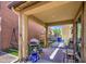 Covered outdoor patio with space for dining, a grill, and outdoor seating in a well-maintained backyard at 7412 E Flower Ave, Mesa, AZ 85208