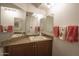 Cozy bathroom features a vanity with storage, ample counter space, and decorative towels at 7755 E Thomas Rd # 17, Scottsdale, AZ 85251