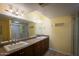 Bathroom features double sinks, a granite countertop, large mirror, and a glass-enclosed shower at 7755 E Thomas Rd # 17, Scottsdale, AZ 85251