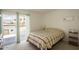 Bright bedroom with a comfortable bed, access to an outdoor patio, and serene views at 7755 E Thomas Rd # 17, Scottsdale, AZ 85251