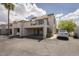 Charming two-story townhome featuring stucco exterior, red tile roof, balcony, and convenient covered parking at 7755 E Thomas Rd # 17, Scottsdale, AZ 85251