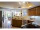 Well-equipped kitchen with granite countertops and stainless steel appliances and a view to the living room at 7755 E Thomas Rd # 17, Scottsdale, AZ 85251