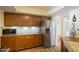 Spacious kitchen featuring stainless steel appliances, granite countertops, and wood cabinetry at 7755 E Thomas Rd # 17, Scottsdale, AZ 85251