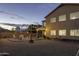 Inviting backyard features stylish patio furniture and ambient string lights at 8221 W Hess Ave, Phoenix, AZ 85043