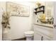 Bright bathroom featuring a modern vanity, decorative accents, and stylish fixtures at 8221 W Hess Ave, Phoenix, AZ 85043