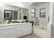This bathroom features double sinks, vanity, lots of counter space and a tub at 8221 W Hess Ave, Phoenix, AZ 85043