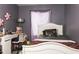 This bedroom features grey-colored walls and a large window for natural light at 8221 W Hess Ave, Phoenix, AZ 85043