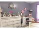This bedroom features a desk, toys, colorful decor and grey-colored walls at 8221 W Hess Ave, Phoenix, AZ 85043