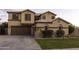 Charming two-story home with a well-manicured lawn and attached two-car garage at 8221 W Hess Ave, Phoenix, AZ 85043
