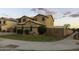 Two-story home with green lawn, desert landscaping, and privacy wall at 8221 W Hess Ave, Phoenix, AZ 85043