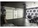 Bright garage with an organized workspace and ample storage, enhanced with modern lighting features at 8221 W Hess Ave, Phoenix, AZ 85043