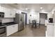 A bright kitchen is equipped with stainless steel appliances and white cabinets at 8221 W Hess Ave, Phoenix, AZ 85043